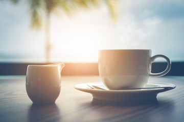 Hot coffee with milk on table  in the morning time