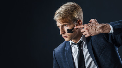Businessman with war paint on his face. Risk management concept.