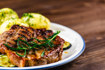 Grilled steak with potatoes and vegetables