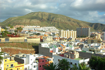 Small town and tourist resort in south-west coast of the island, in Arona Municipality with Montana de Guaza in the background, Los Cristianos, Tenerife, Canary Islands, Spain