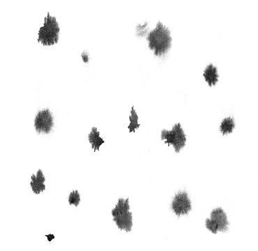 Isolated artistic black watercolor and ink splatter textures and decorative elements on white wall background.