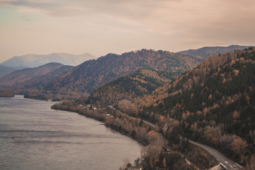 Autumn mountain forest landscape with roads and rivers