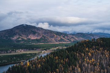 Autumn mountain forest landscape with roads and rivers