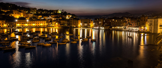 Fototapeta na wymiar Illumination in Bay of Silence, Liguria, Italy