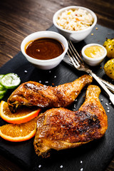 Grilled chicken legs with boiled potatoes and vegetables