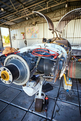 Engine maintenance of a single-engine parkenge aircraft in the hangar.