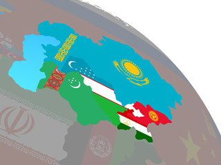 Central Asia with national flags on simple blue political globe.