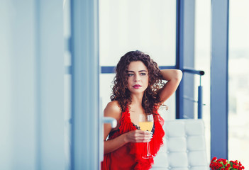 Portrait of young happy cheerful beautiful woman with glass of wine