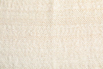 Light natural hemp cloth as background. Fabric texture