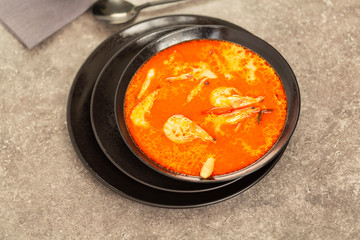 Thai spicy-sour soup Tom Yam with shrimp
