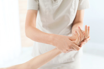 Obraz na płótnie Canvas Woman receiving hand massage in wellness center, closeup