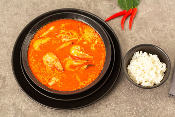 Thai spicy-sour soup Tom Yam with shrimp