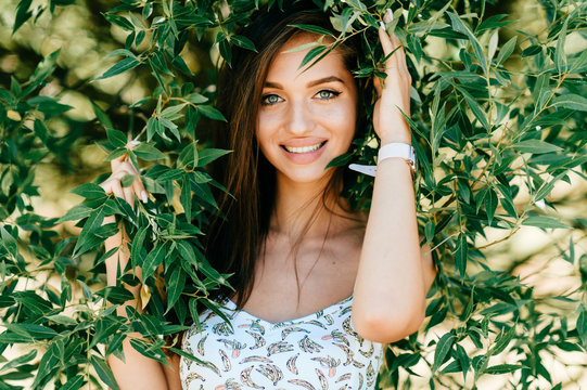 Closeup lifestyle portrait of celebrity female model.  Beautiful girl face on abstract nature background. Cheerful amazing young woman face expression. Sexy blue eyed babe. Glamour youth appearance.