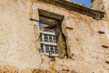 Fototapeta na wymiar Empty window opening in an old abandoned house
