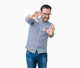 Handsome middle age elegant senior man wearing glasses over isolated background Smiling doing frame using hands palms and fingers, camera perspective