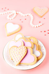 Valentine's day cookies close up on pink background.