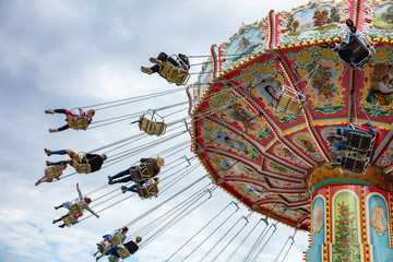 Carousel on cloudy sky background. Oktoberfest, Bavaria, Germany © Rawf8