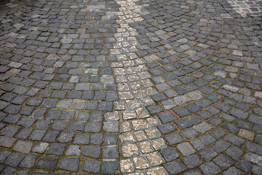 Memorial in Munich city center. Gold pathway marked out on the cobblestone