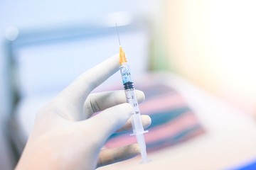 Medical hand glove blue molding vial vaccine hypodermic needle syringe injection treatment.Lab...