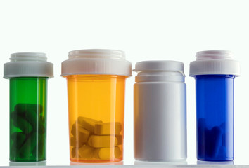 Different types of cosmetic containers and isolated medicines on a white background