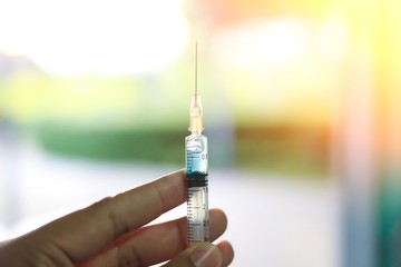 Medical hand glove blue molding vial vaccine hypodermic needle syringe injection treatment.Lab...