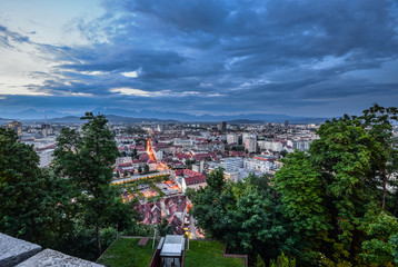 Evening view on Ljubljana old town and city center from Ljubljana Castle, Slovenia. Alps and Ljubljana cityscape.