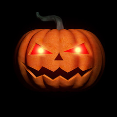 Halloween pumpkin with glowing eyes in the dark.