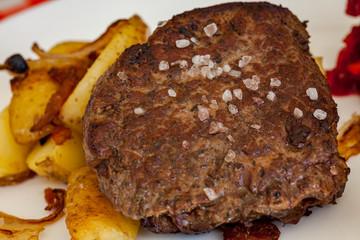 Dinner plate - Steak with baked potatoes, grated beets and salad