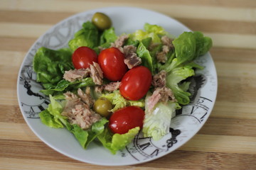 fresh salad with tuna, cherry tomotoes, olives, iceberg 
