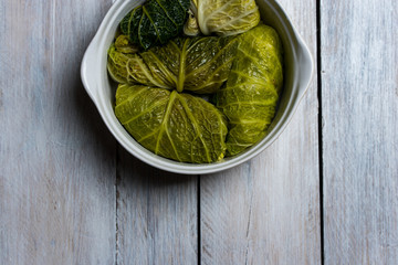 a fresh dish of meat and rice wrapped in green cabbages