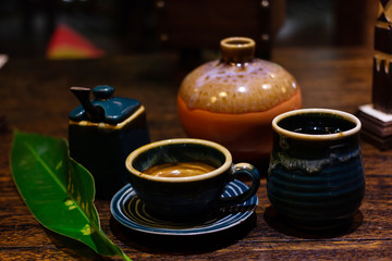 Obraz na płótnie Canvas Tea and coffee In a ceramic cup on table wood 