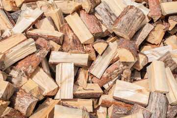 A pile of firewood from birch on the lawn Texture to Chop wood