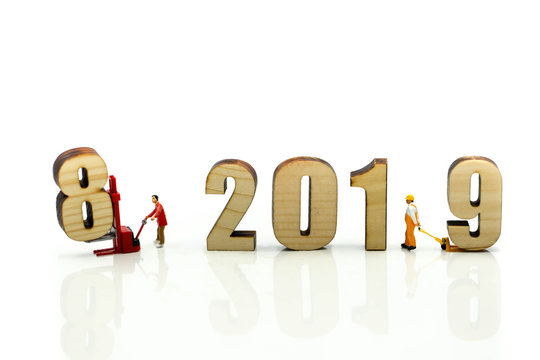 Miniature people : Worker with wooden of number 2019,Happy New Year 2019 concept.