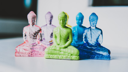 plastic buddha statue in colors