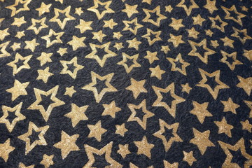 Viele goldene  Sterne auf dunklem Hintergrund