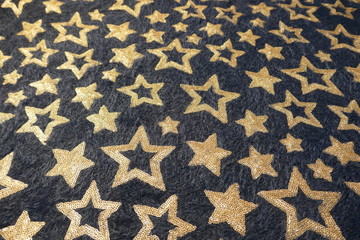 Viele goldene  Sterne auf dunklem Hintergrund