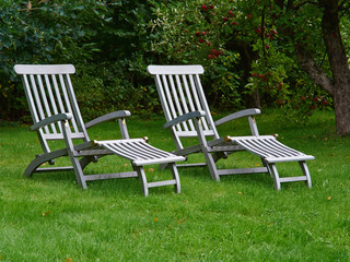 Relaxing comfortable classical lounge chairs in the garden