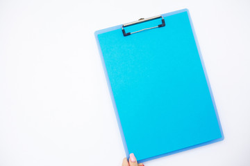 Blank Folder with Blue Paper. Hand that Holding Folder and Pen on White Background. Copyspace. Place for Text