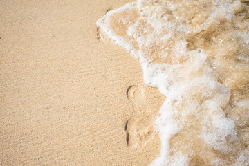 Footprints in the sand at beautiful Makalawena beach in Kailua Kona, Big Island Hawaii (United States)
