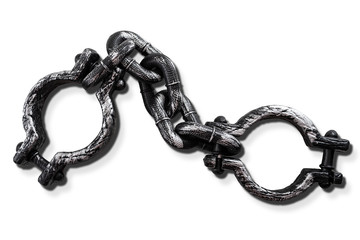 Slavery and bondage concept with strong steel shackles isolated on white background with a clip...