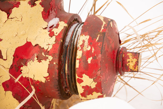 peeling red and yellow fire hydrant
