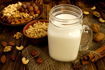 Ingredients for cooking  nut milk on the rustic wooden background