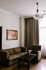 The interior of the living room in bright colors. The concept of home comfort in the hotel.
