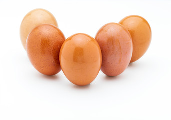 Five (5) raw and fresh eggs. Isolated on white background.