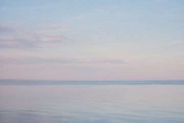 Fototapeta na wymiar Blue sky landscape without clouds spreading on the sea