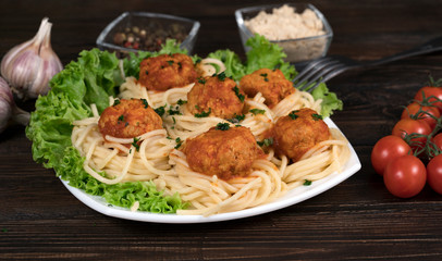 pasta with meat and chili tomatoes on wooden background