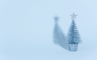 Christmas tree over light blue background.