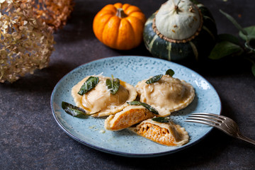 Pumpkin and ricotta ravioli with crispy sage, burnt butter sauce and parmesan
