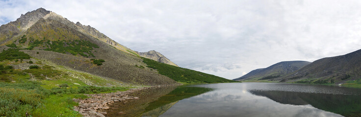 Panorama of the lake Big Hadatayoganlor on a cloudy August day. Polar Ural, Russia