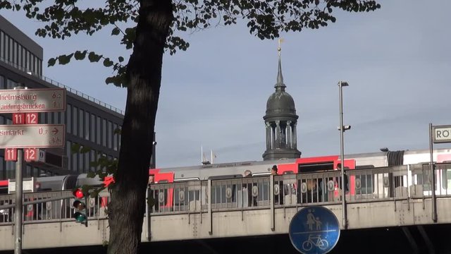Motion Time lapse: Incoming train at the Subway station "Roedingsmarkt", Hamburg, Germany. In the background the St. Michael's Church (German: Hauptkirche Sankt Michaelis), colloquially called Michel